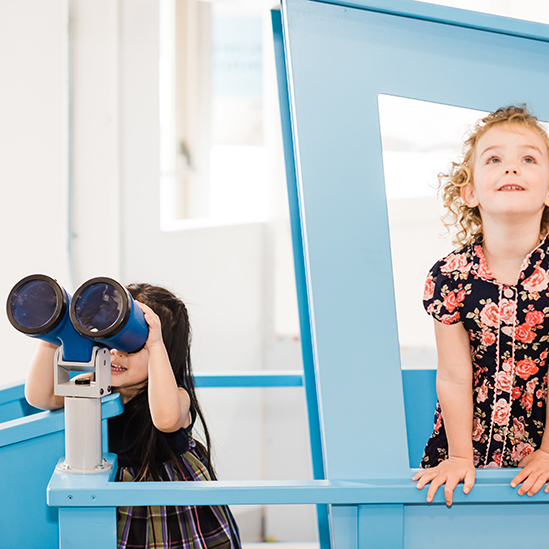 children using play binoculars